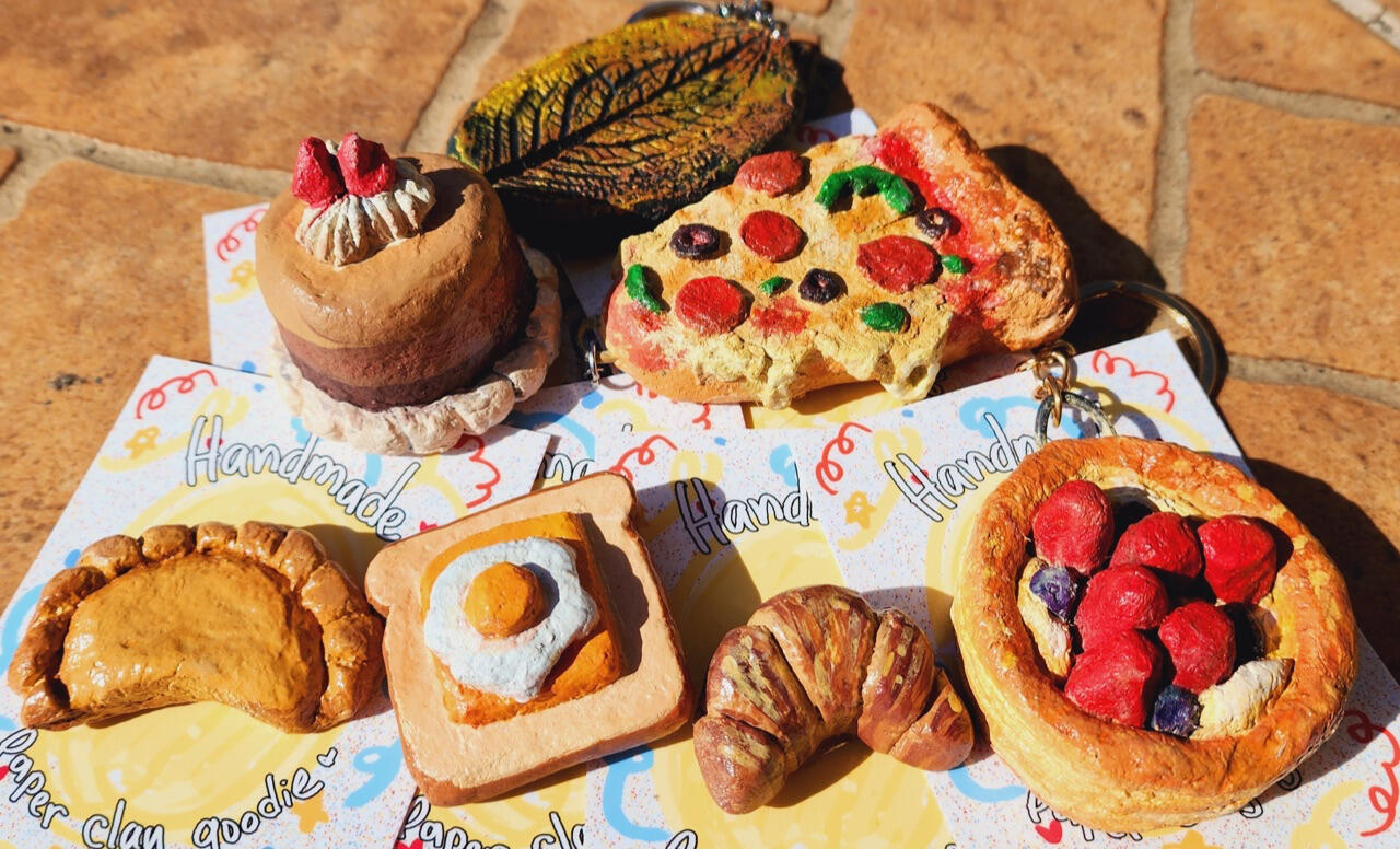 Handmade, handpainted recycled paper clay keychains, pins and magnets